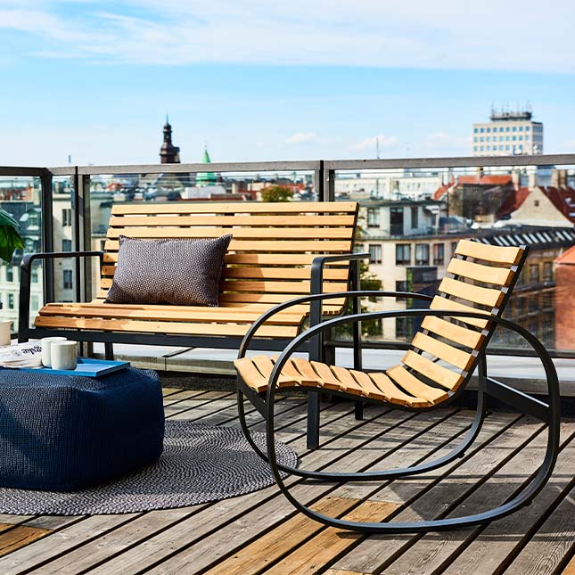 Parc Chairs by Caneline in Roof Terrace Setting Showing City Skyline