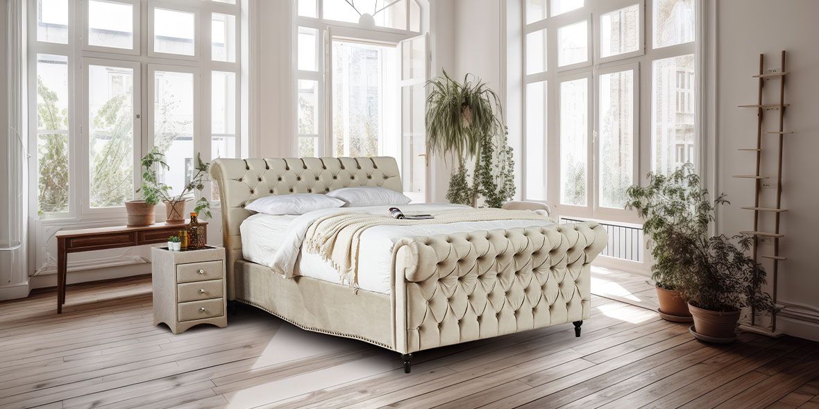 Bright lifestyle image of a classic buttoned ottoman bed
